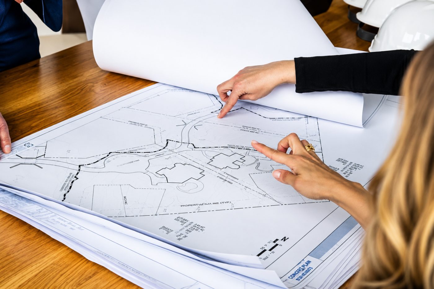A project team reviewing residential site plans